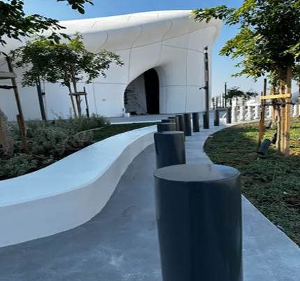 Terra Shallow Venus Bollards PAS-rated security barriers installed along a modern building walkway, providing hostile vehicle mitigation and perimeter protection – fpgulf.com.