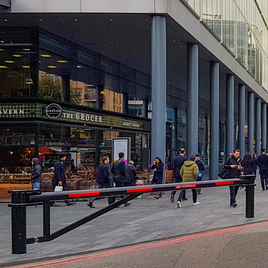 IWA 14 Terra 180° manual swing barrier installed at a building entrance for HVM perimeter security (7.2t @ 48kph).