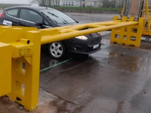 Crash rated gate barrier test showing a vehicle stopped by a high security perimeter barrier.
