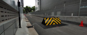 Crash rated road blocker securing a restricted vehicle lane for high-security perimeter protection.