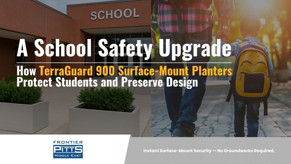 Frontier Pitts Middle East visual showing TerraGuard 900 surface-mount security planters installed at a school entrance, illustrating student safety and modern campus design with the title ‘A School Safety Upgrade: How TerraGuard 900 Surface-Mount Planters Protect Students and Preserve Design.