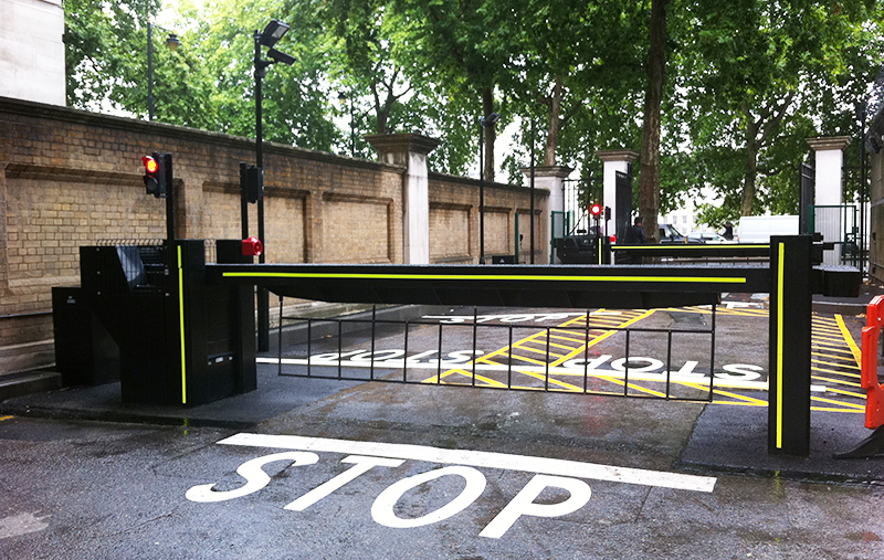 Hostile vehicle mitigation barrier installed along city sidewalk for perimeter protection